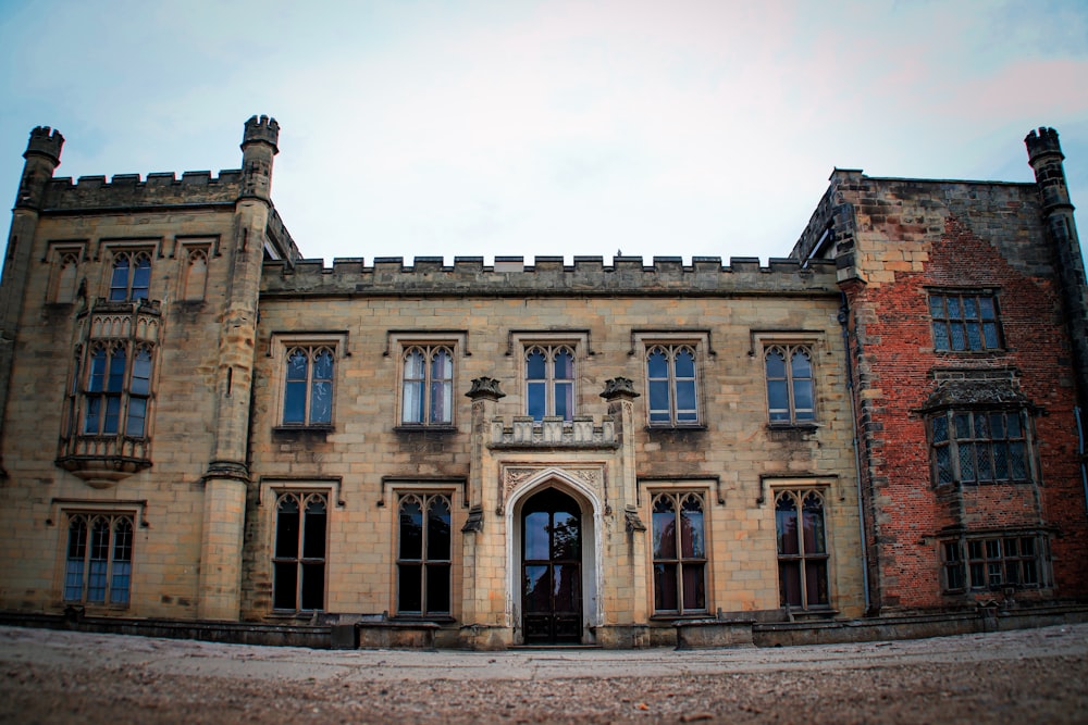 a large brick building with a clock on the front of it