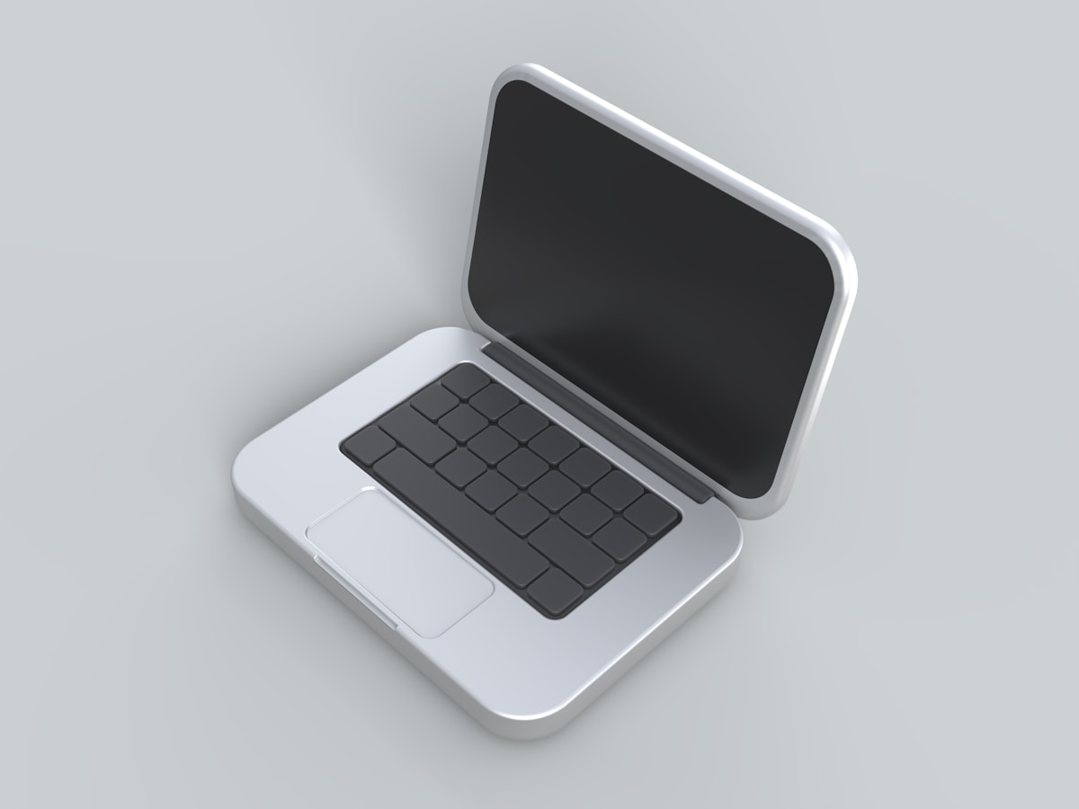 An open laptop computer sitting on top of a table