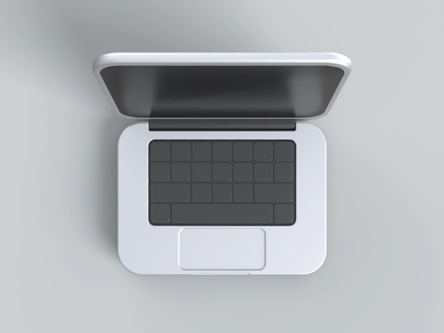 Witte laptop van bovenaf op een lichte ondergrond