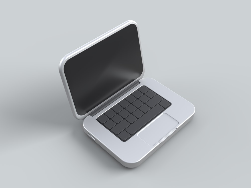 un ordinateur portable ouvert posé sur une table