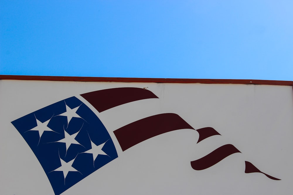 an american flag painted on the side of a building