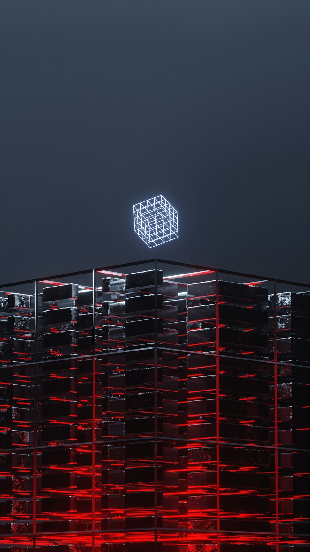 a tall building with a neon cube on top of it