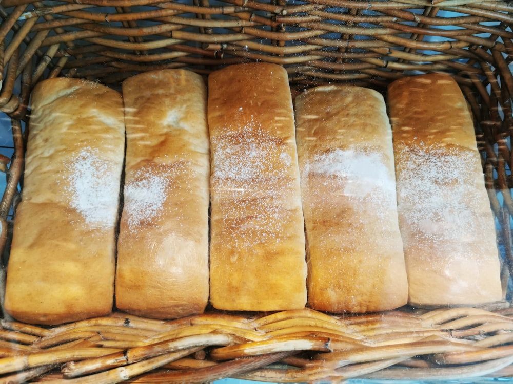 a basket filled with loaves of bread