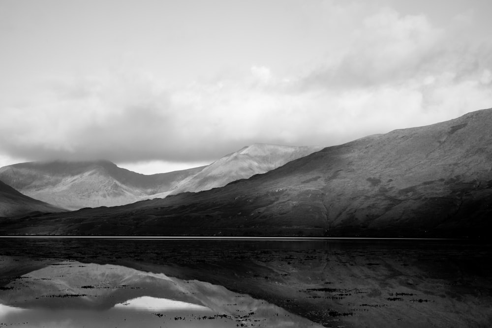 a black and white photo of a mountain range