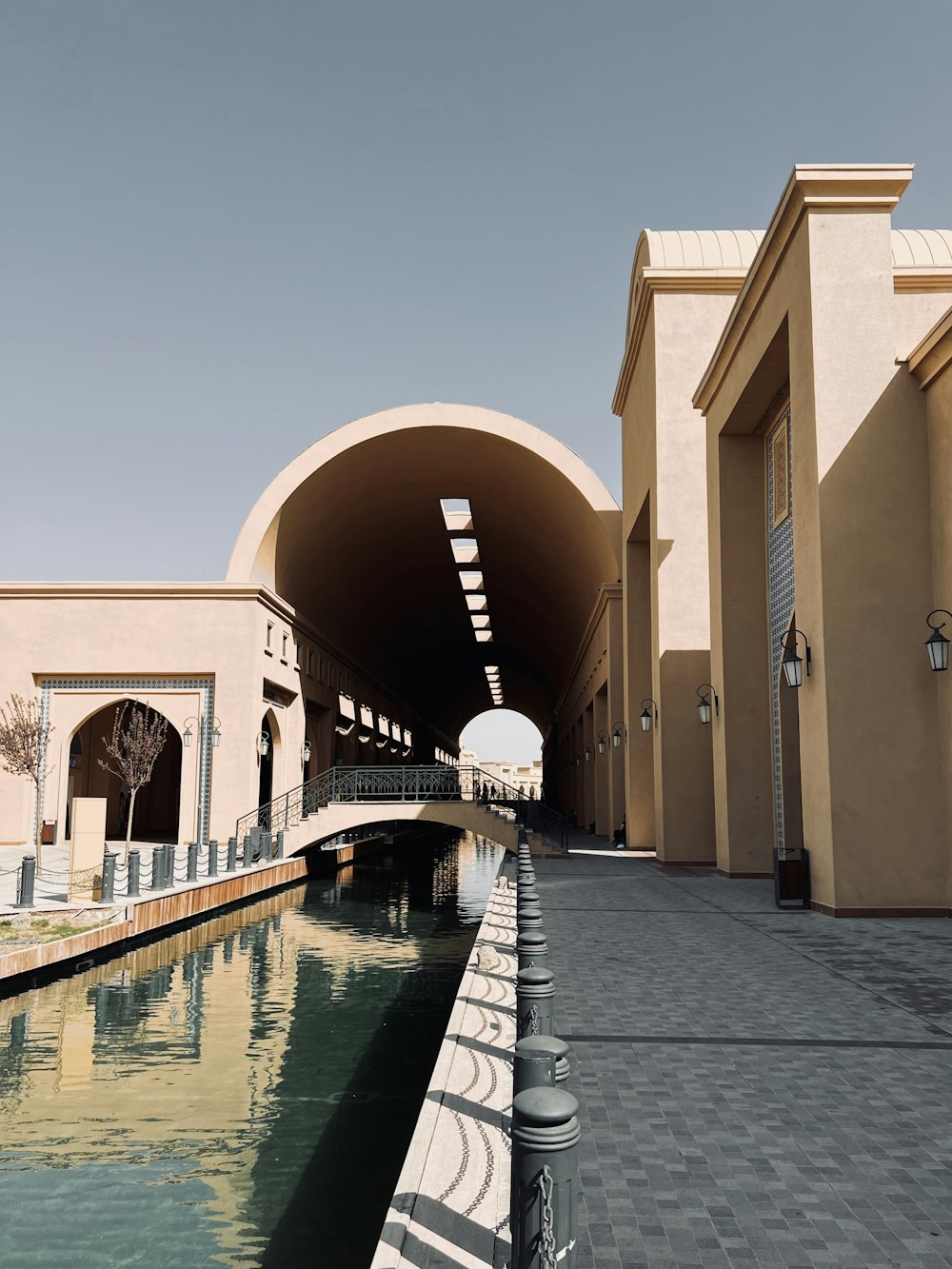 a waterway in front of a large building