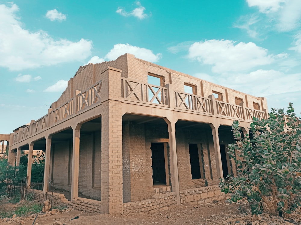 a brick building with a balcony and balcony railing