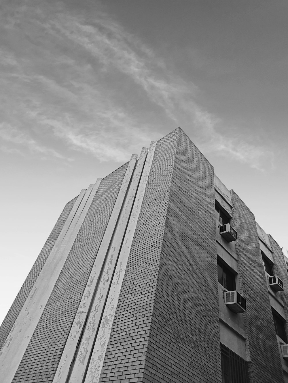 a black and white photo of a tall building