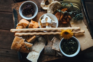 a wooden table topped with different types of food