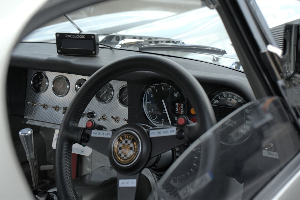 a steering wheel and dashboard of a car