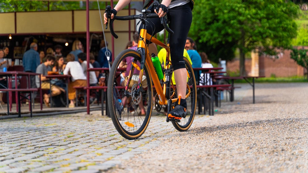 a person riding a bike down a street