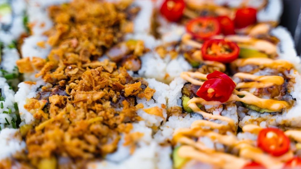 a close up of a plate of food with rice and vegetables