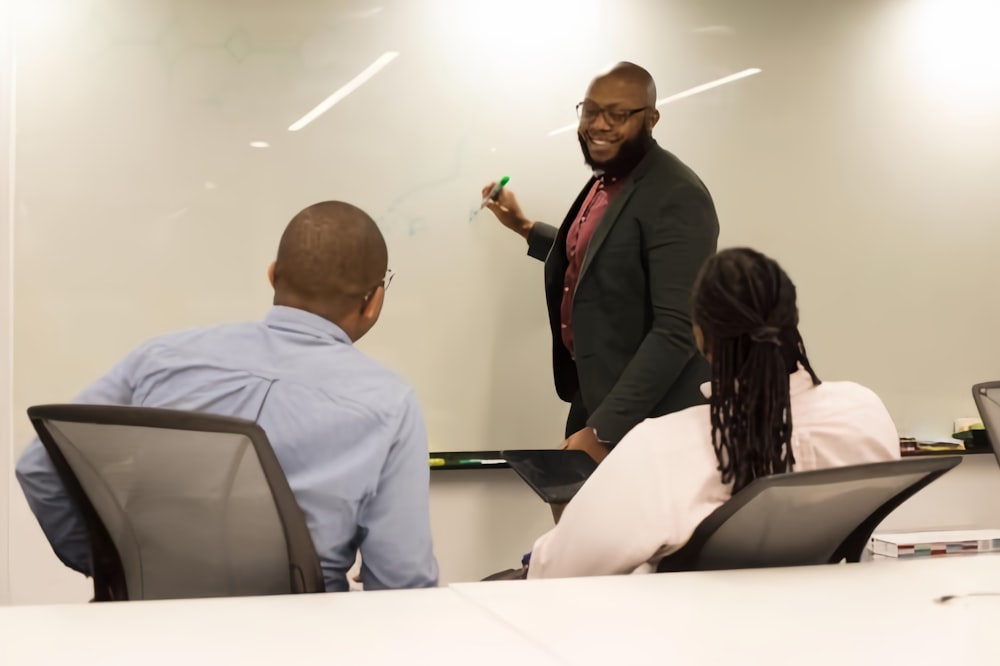 a man giving a presentation to a group of people