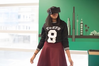a woman wearing a skirt and a sweater with a hat on her head