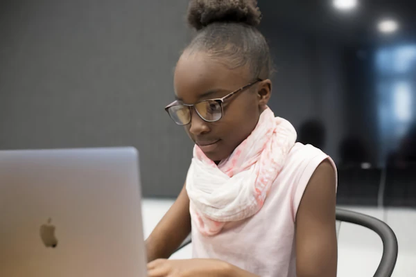 A girl in front of a laptop