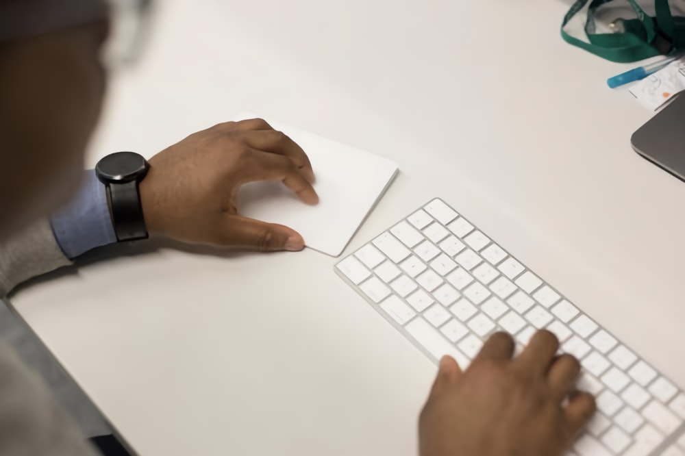 a person is typing on a computer keyboard