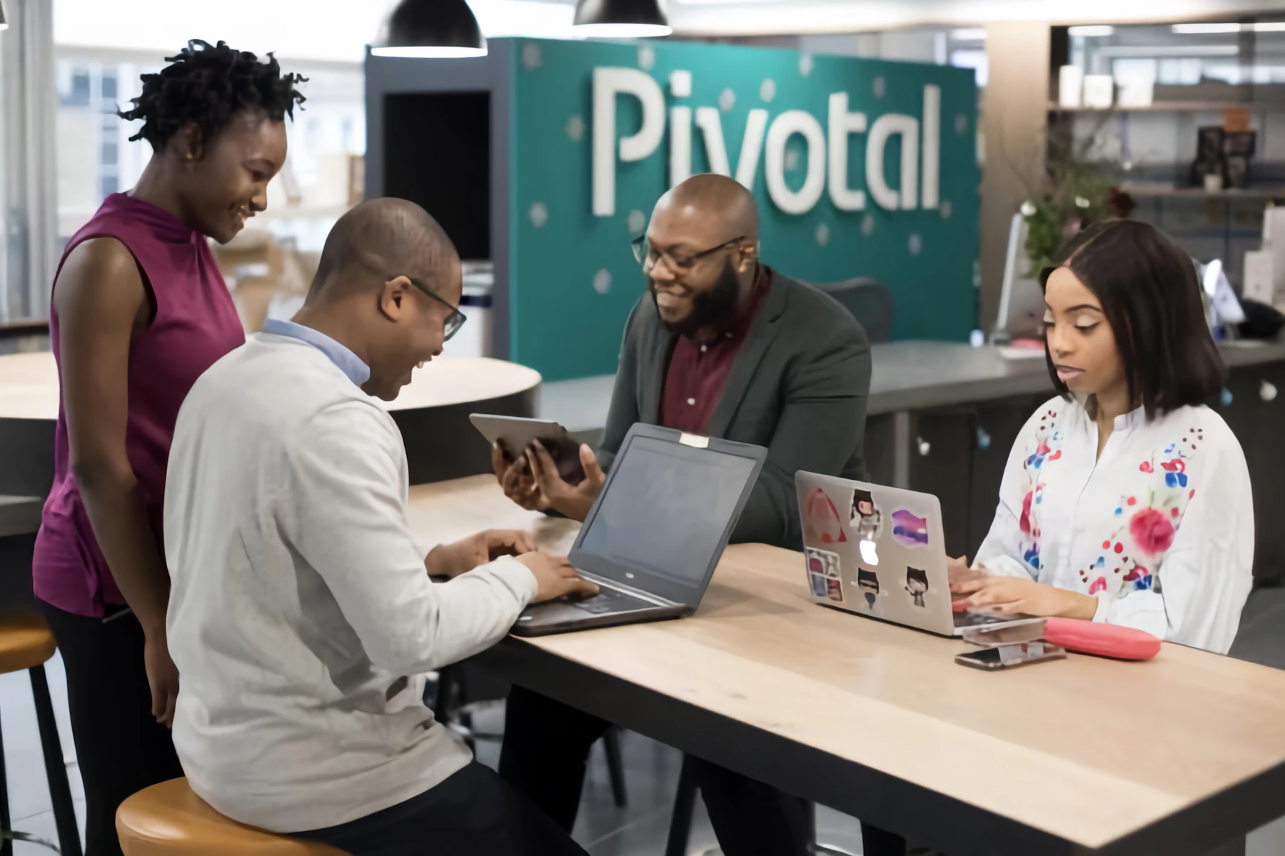 Business team working together around laptops