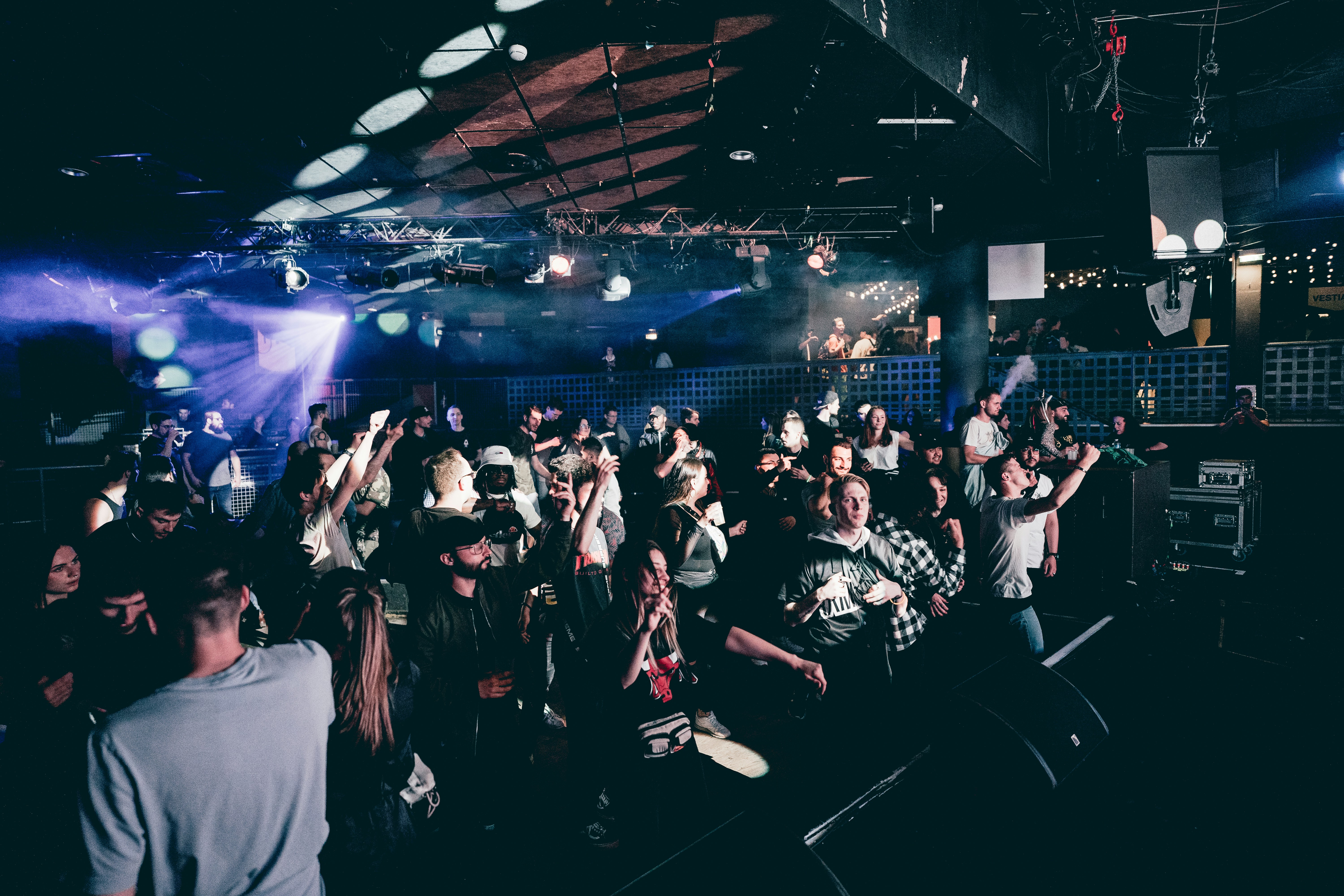 a crowd of people standing around a stage