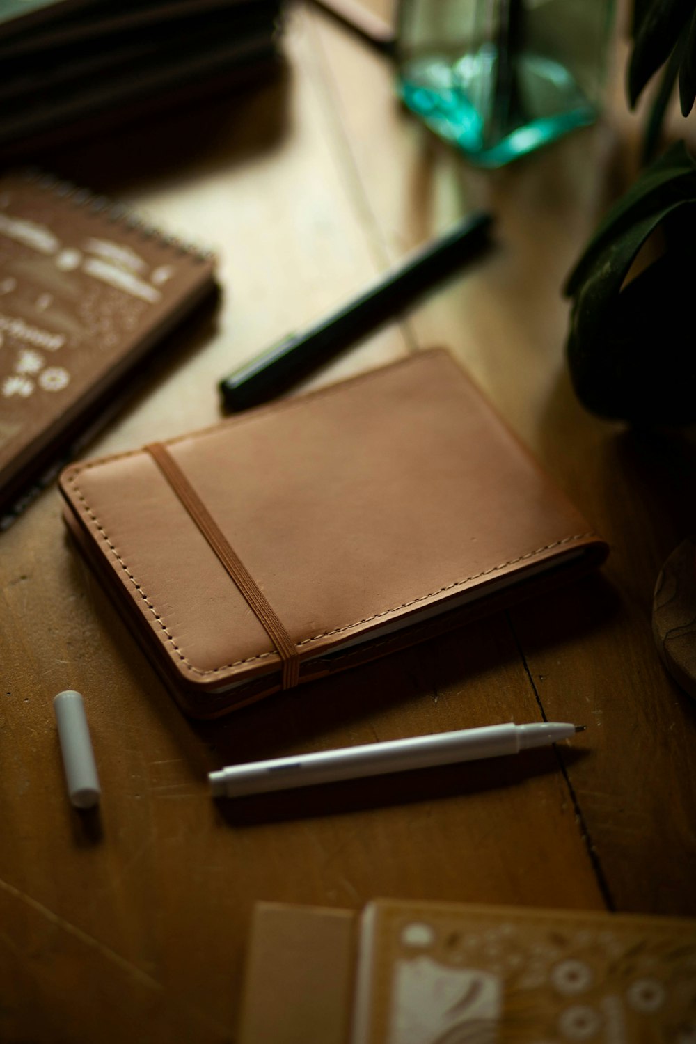 a notebook and pen sitting on a table