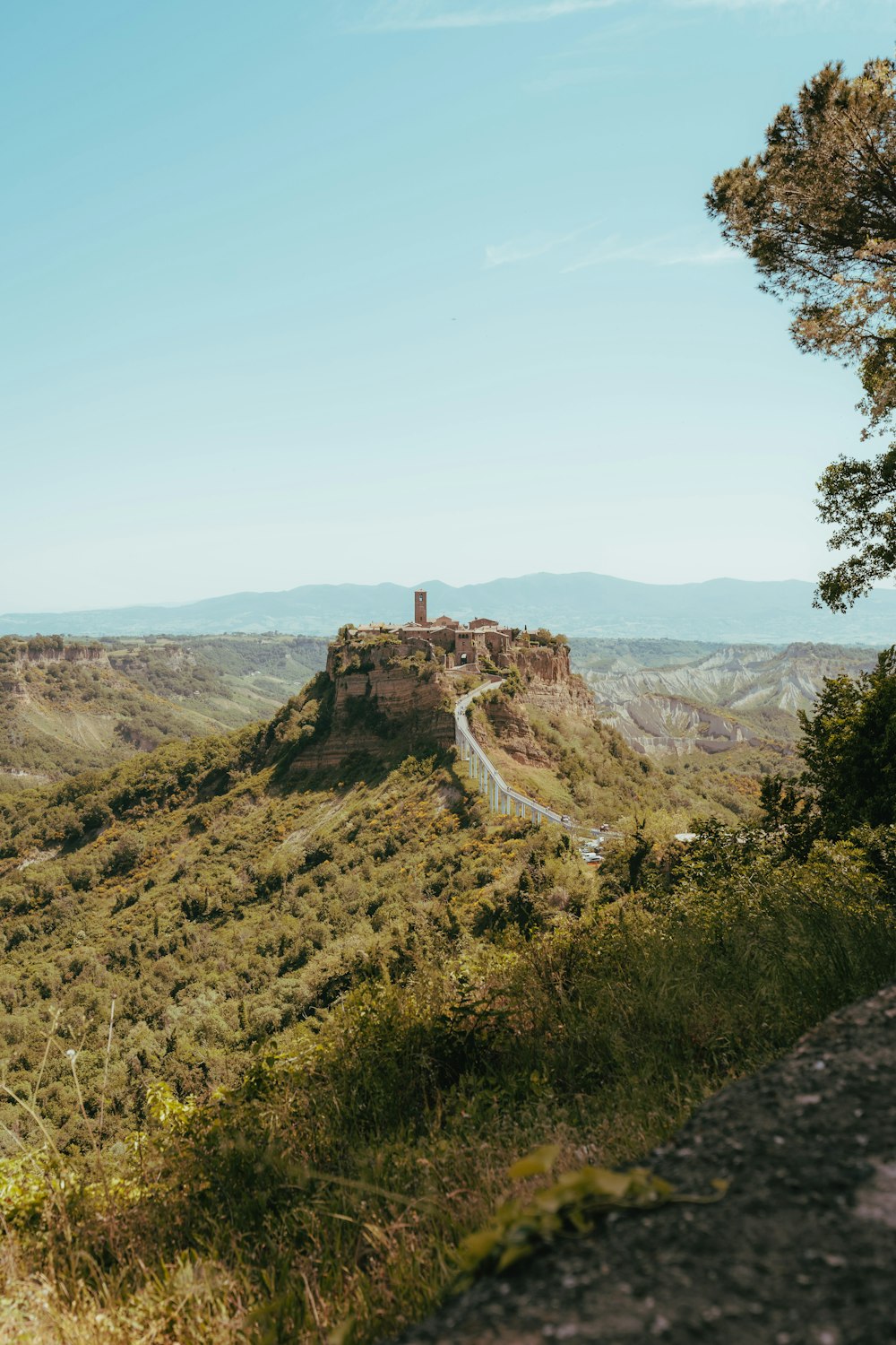 a scenic view of a castle on top of a hill