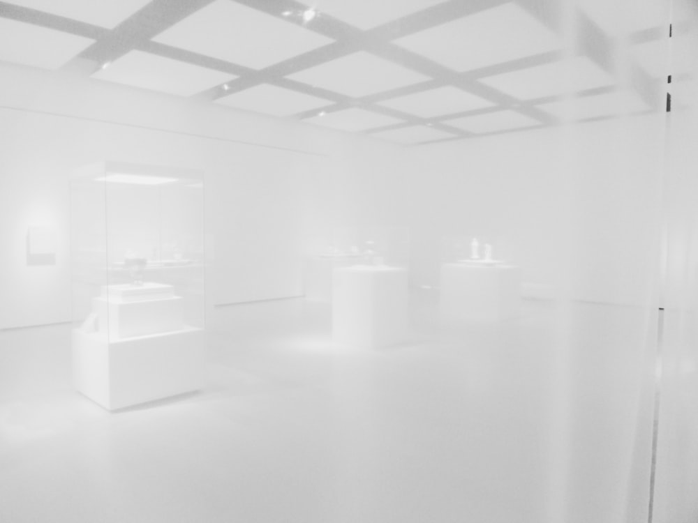 a white room with a lot of white furniture