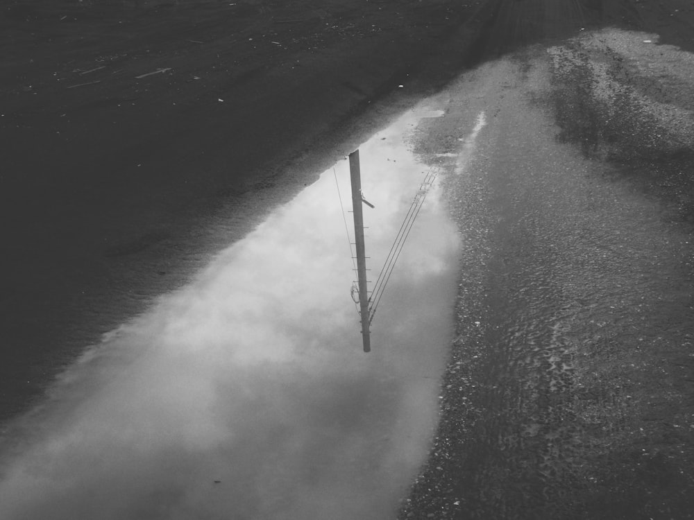 a black and white photo of a flooded street