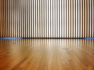 a room with a wooden wall and wooden floor