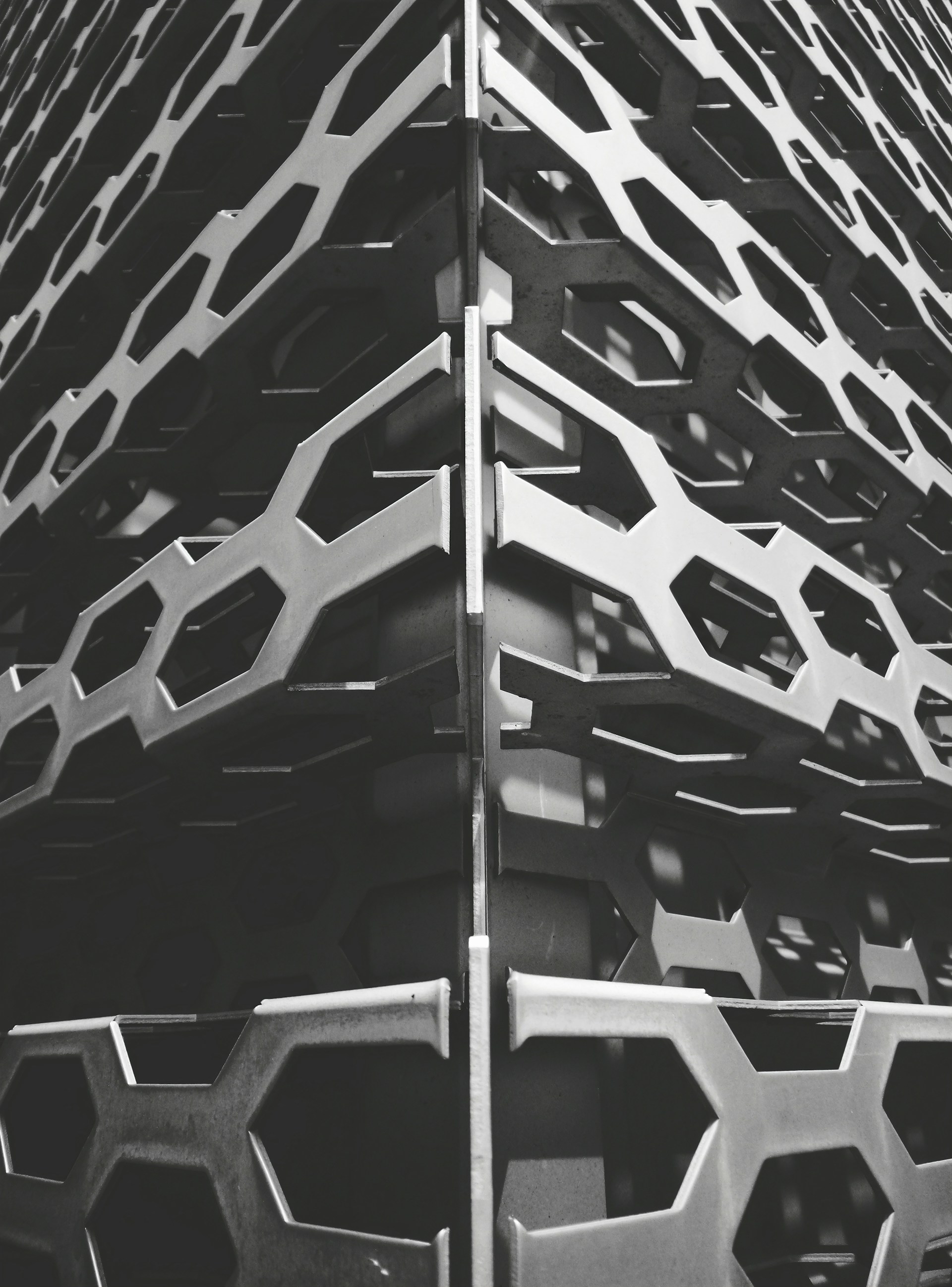a tall metal structure with many different shapes