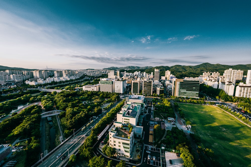 an aerial view of a city with tall buildings