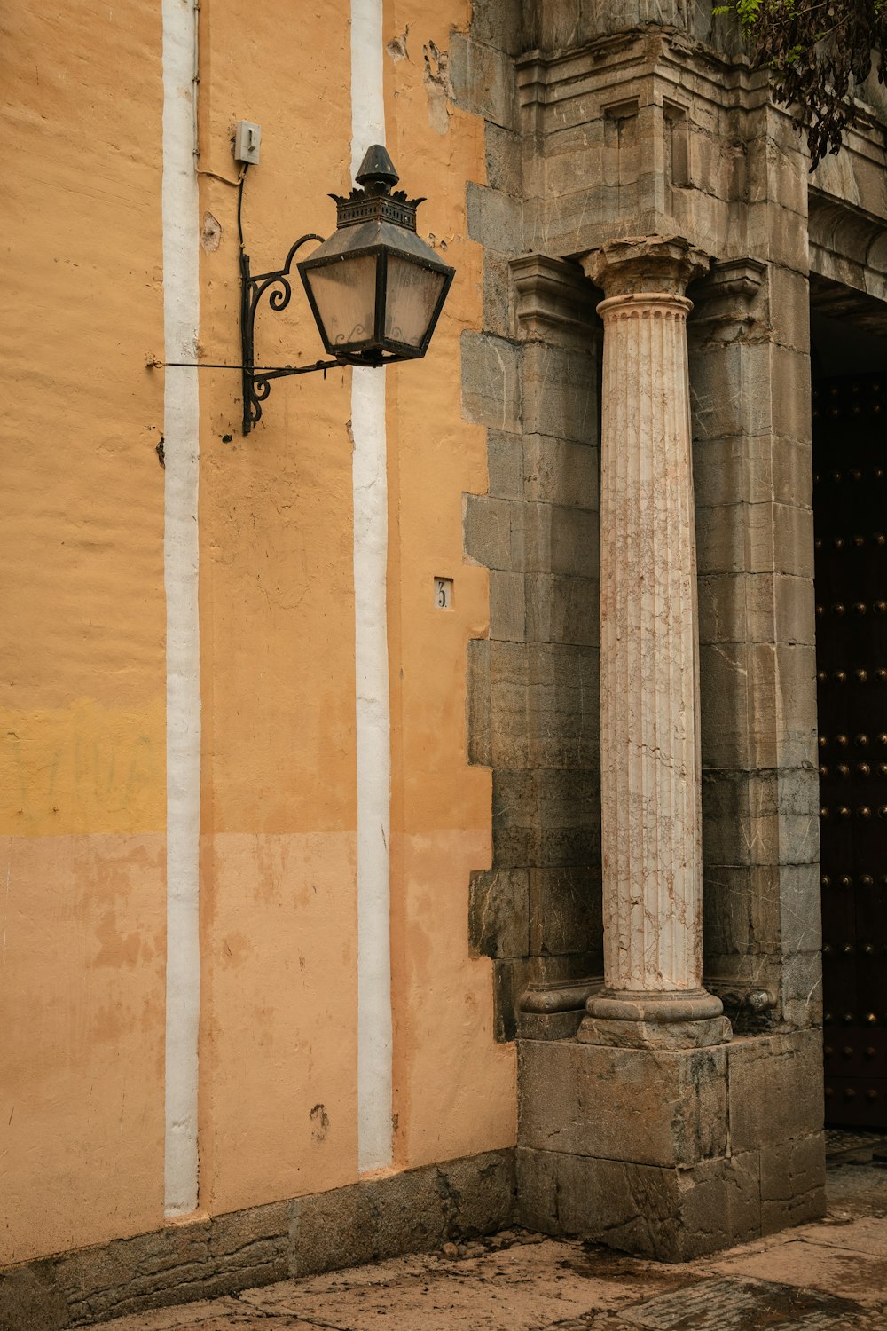 a lamp on the side of a building