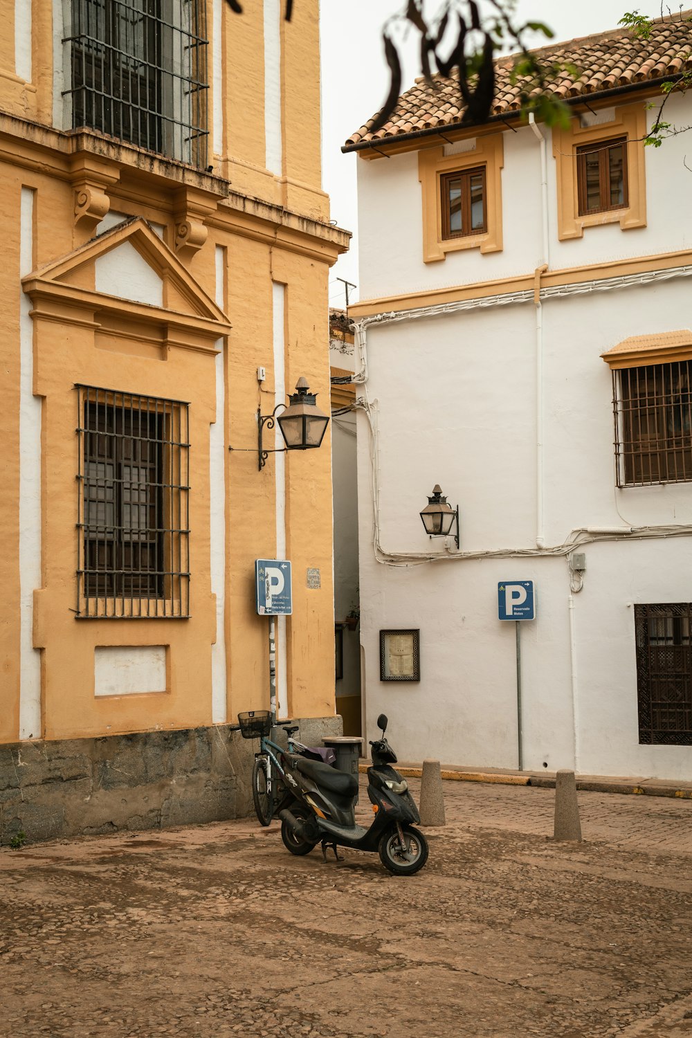 a motor scooter parked in front of a building