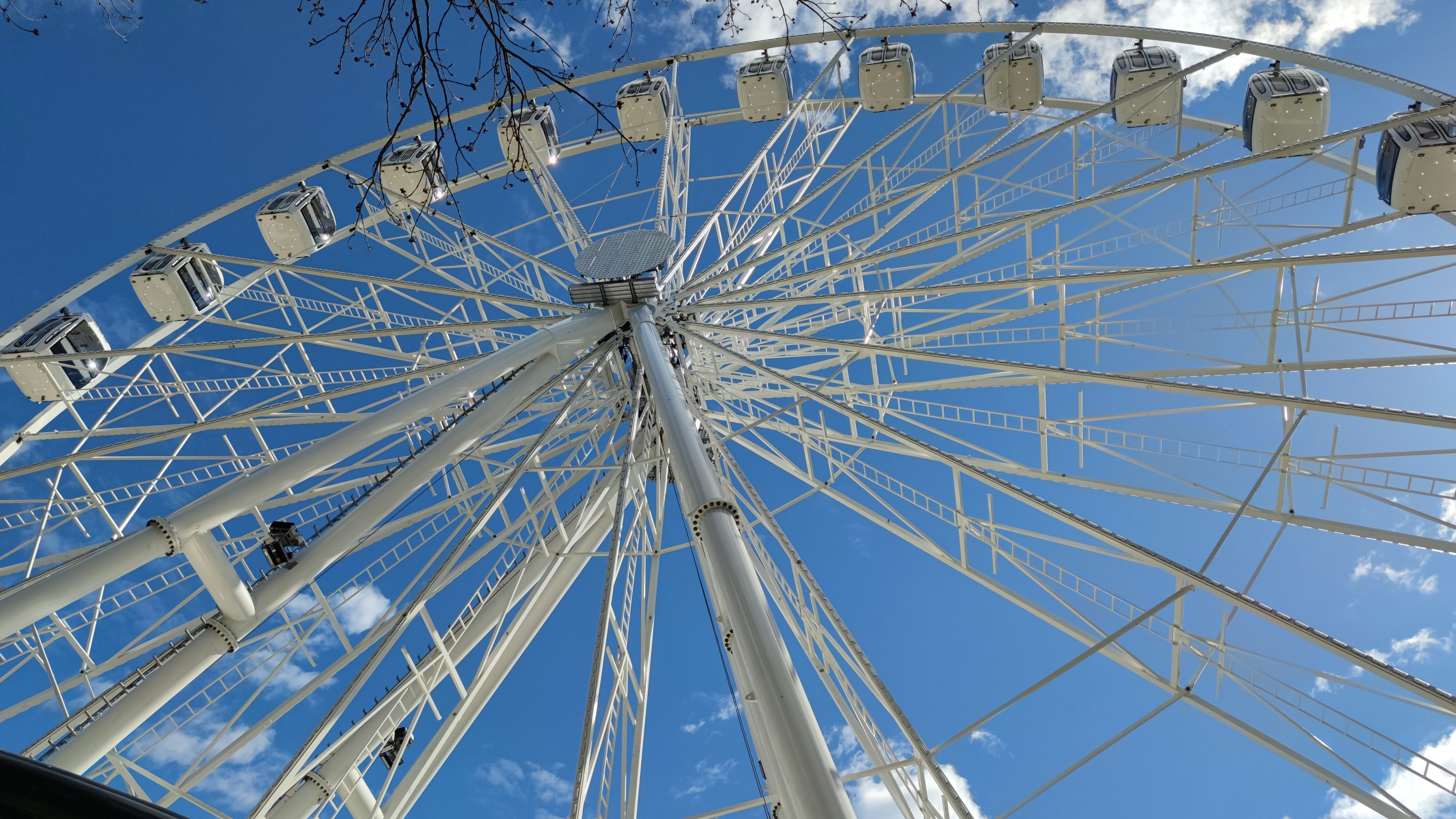 a large ferris wheel on a sunny day