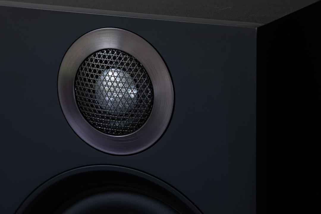 a close up of a speaker on a black surface,