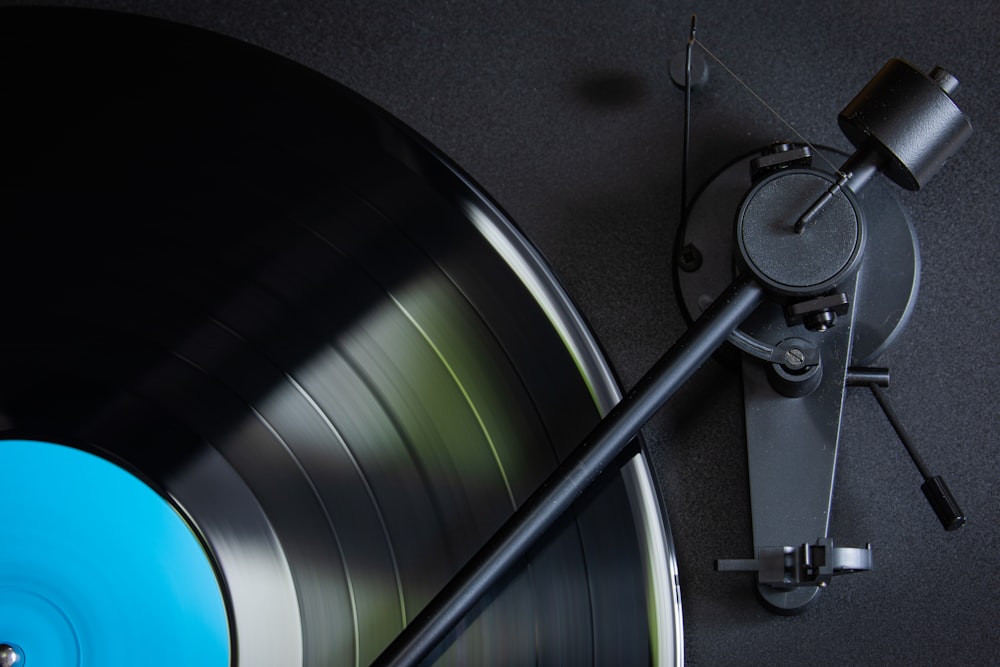 an old record player with a blue disc
