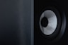 a close up of a speaker with a black background