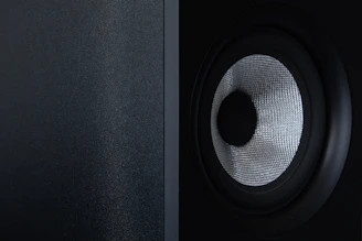 a close up of a speaker with a black background