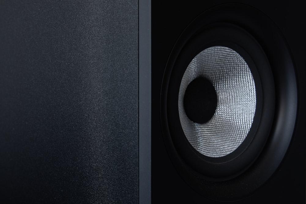 a close up of a speaker with a black background