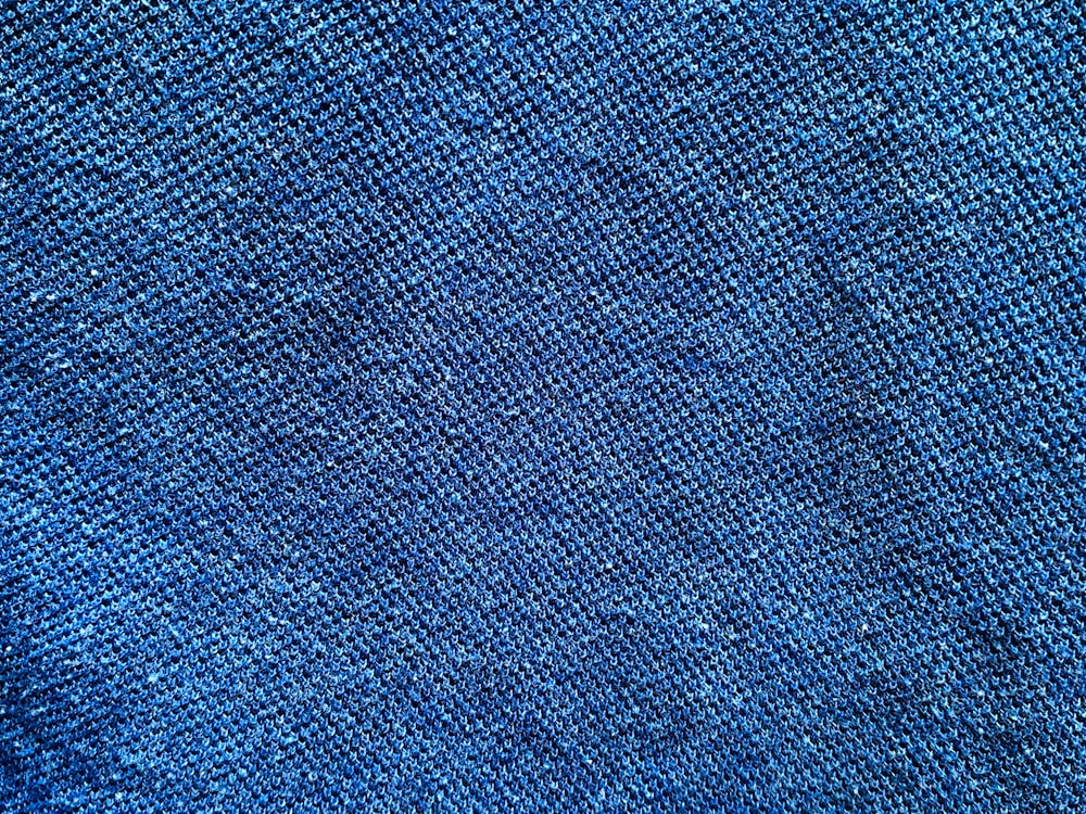 a close up of a blue fabric texture