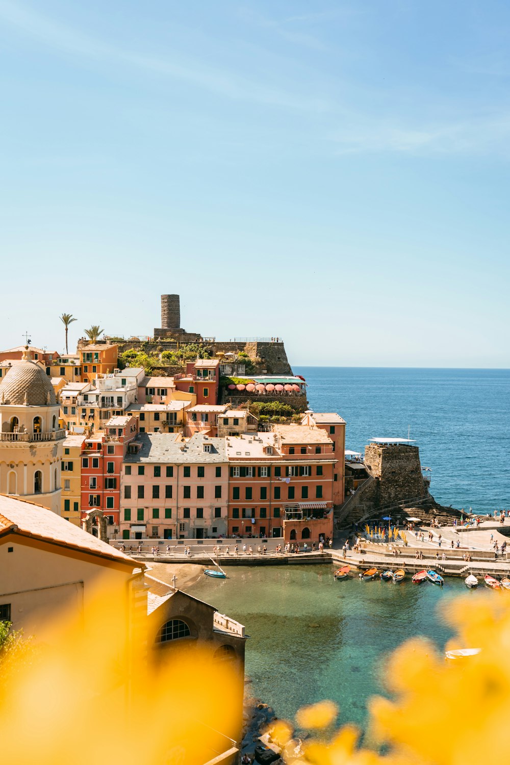 a view of a small town on the coast of a body of water