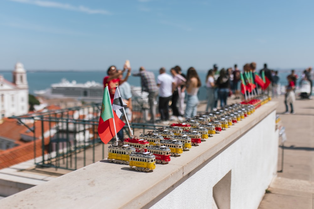 a group of people standing on top of a bridge