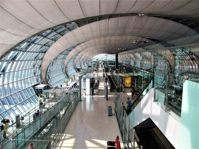 a view of a train station from the top of the escalator