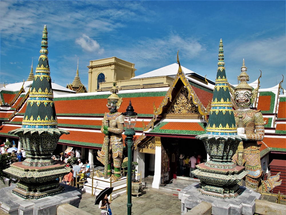 a group of statues in front of a building