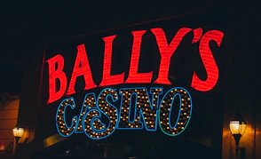 a neon sign for a casino called bally's casino