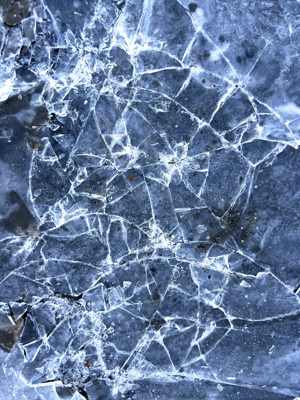 a close up of a cracked glass surface