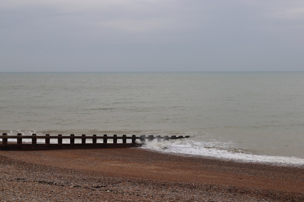 a beach with waves coming in to the shore