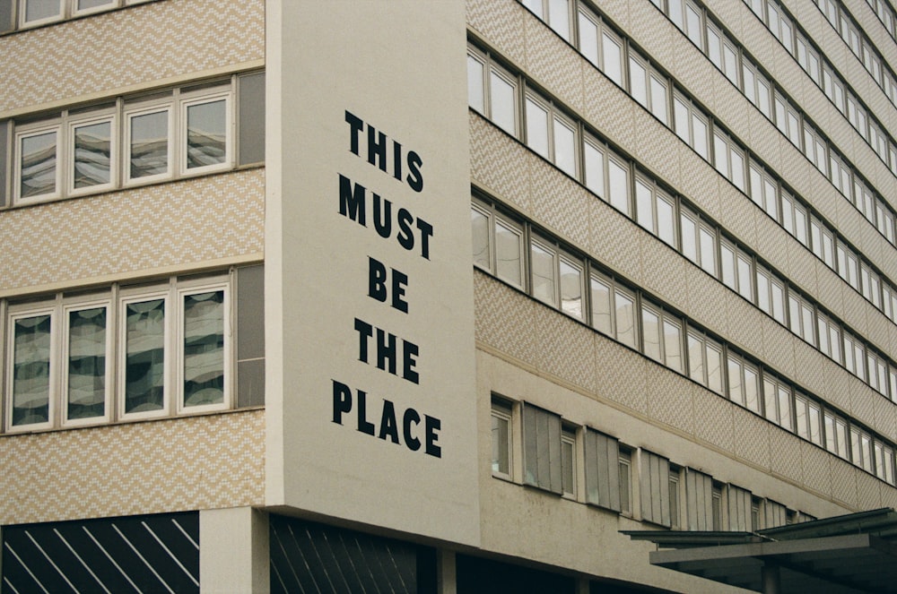 a building with a sign that says this must be the place