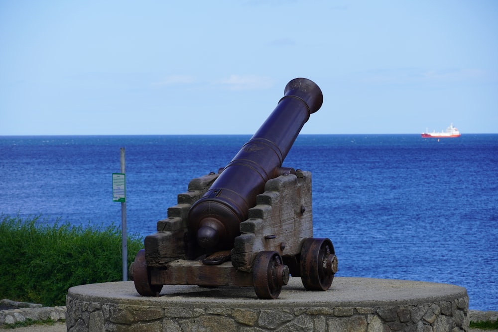 an old cannon sitting on top of a stone wall