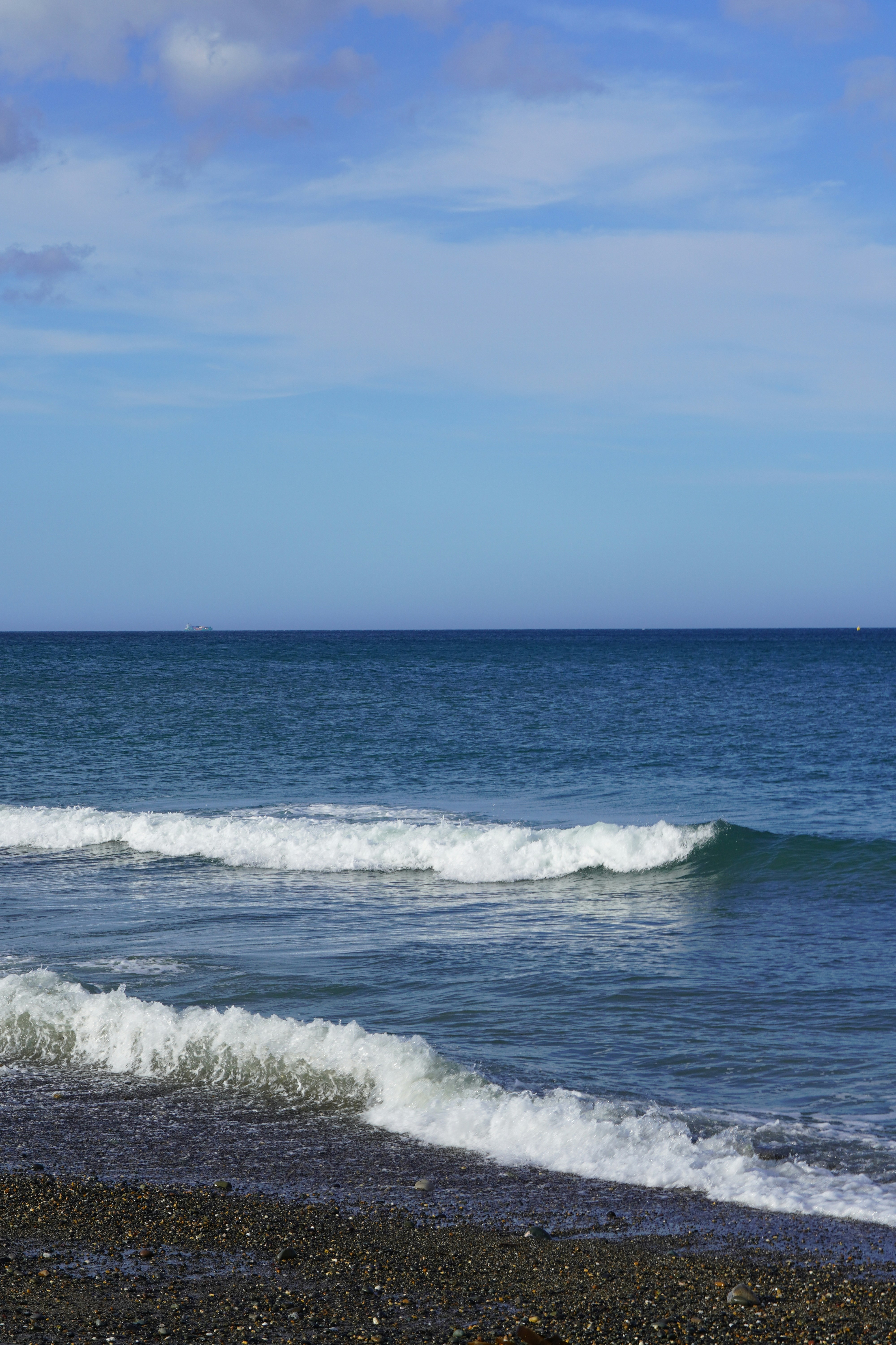 a person riding a surfboard on top of a wave