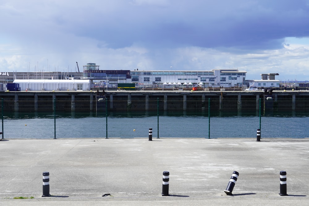 a large body of water with a bridge in the background