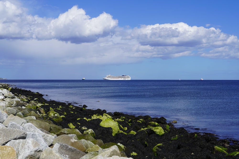 a cruise ship is in the distance on the ocean