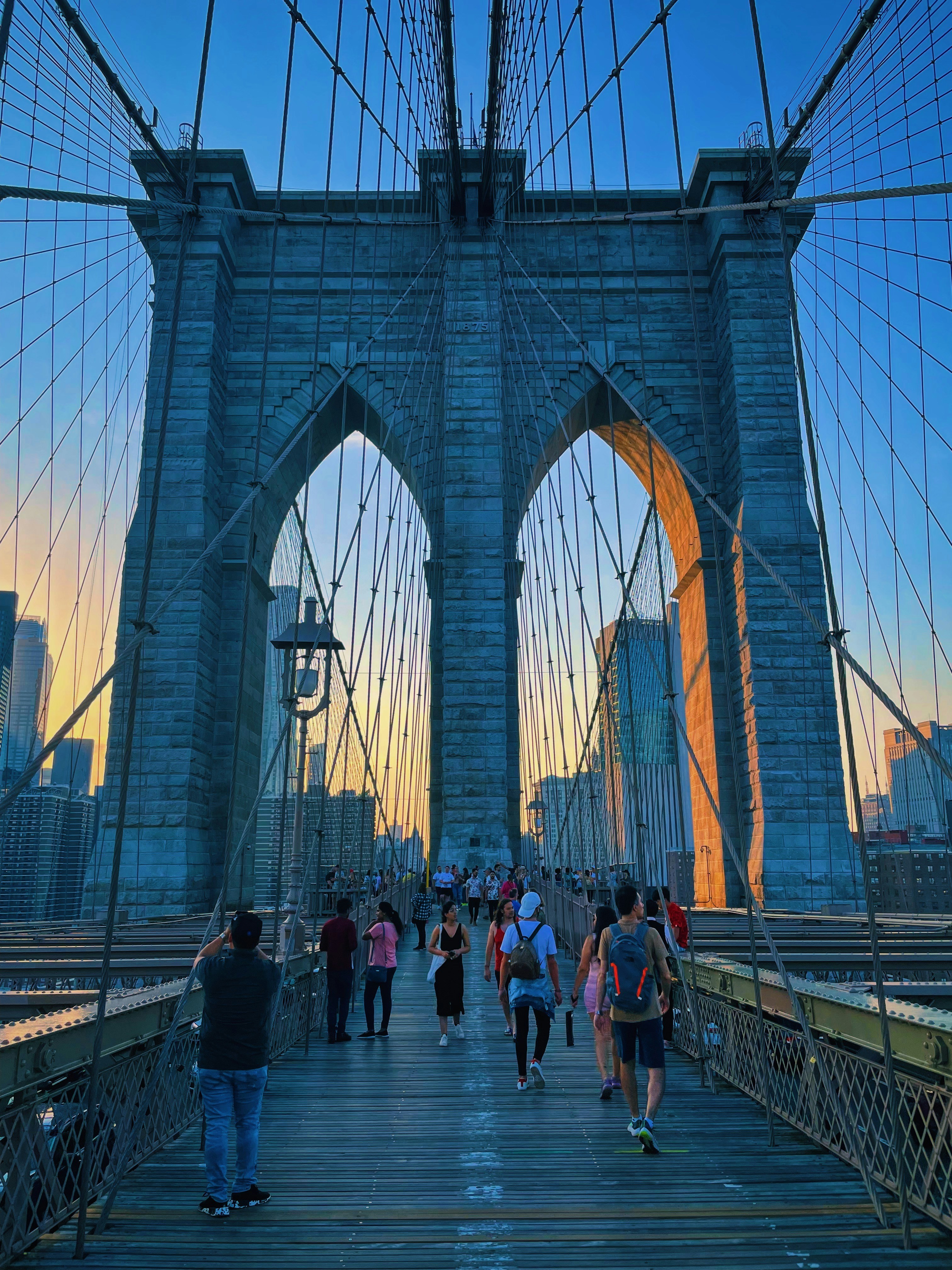 A group of people walking across a bridge photo – Free New york Image ...